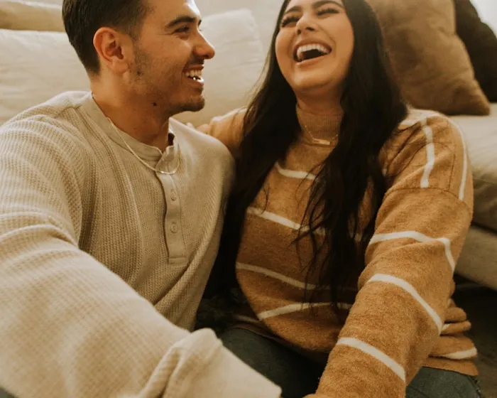 Smiling couple reviewing their property tax appeal paperwork together